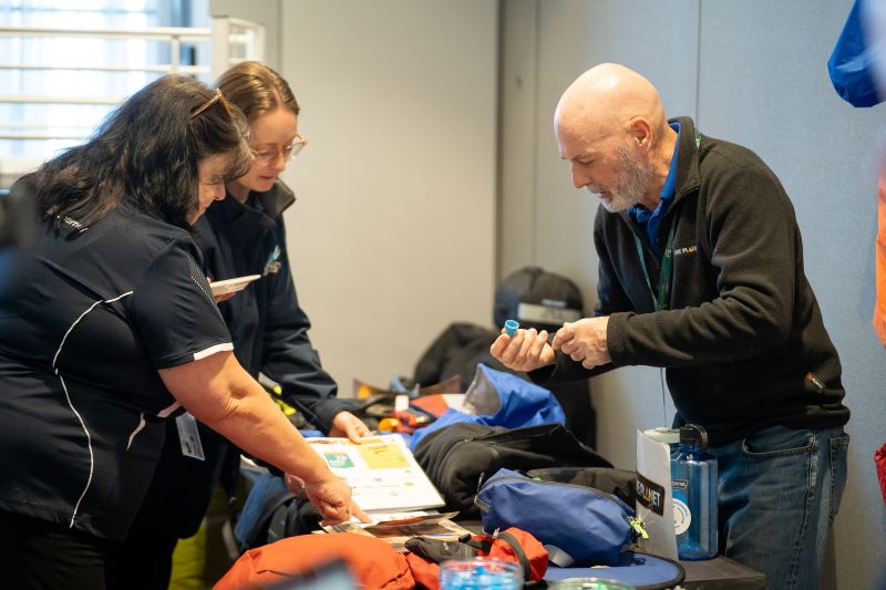 Trade Exhibit holder One Planet showing their product to delegates